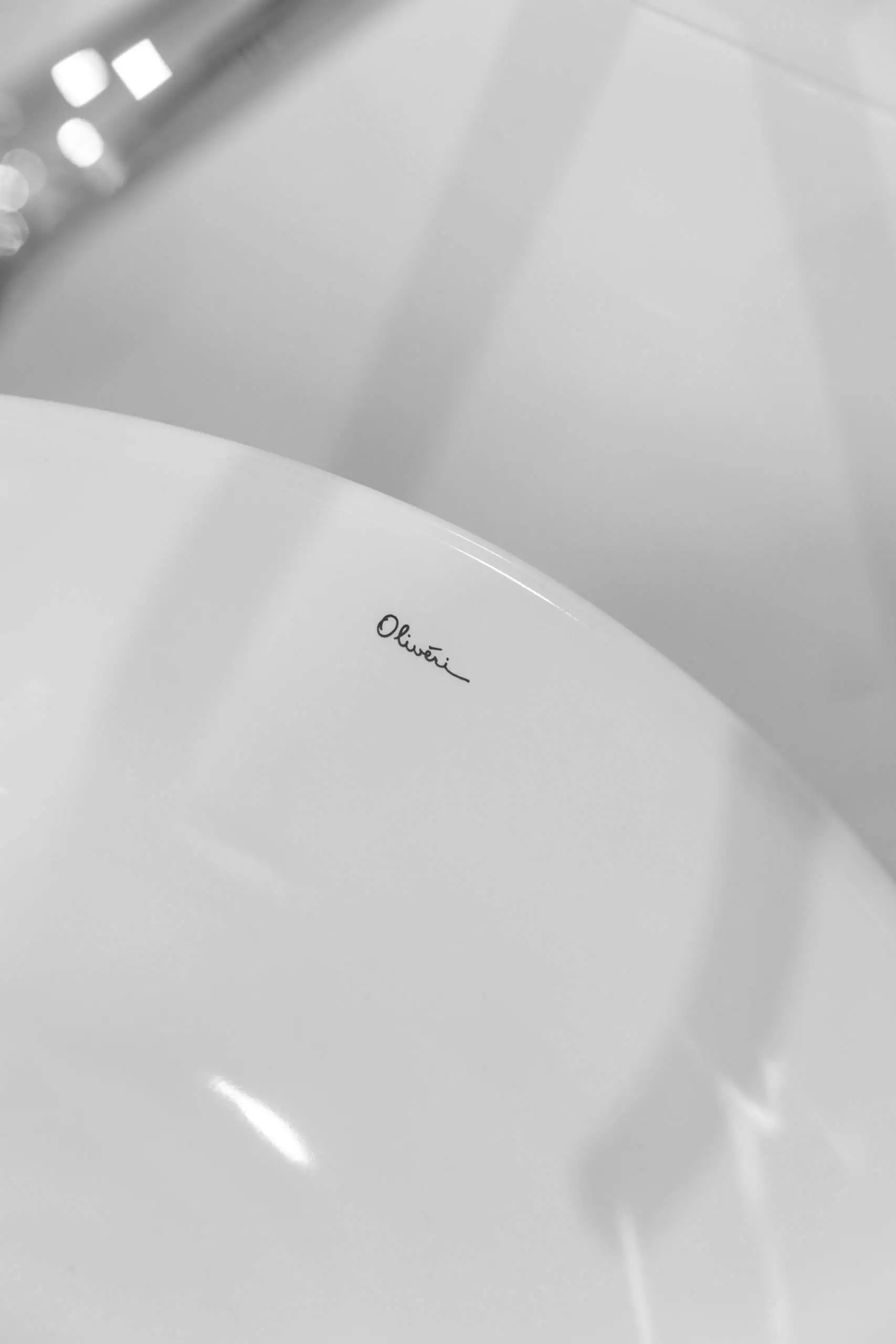 White sink with brand signature