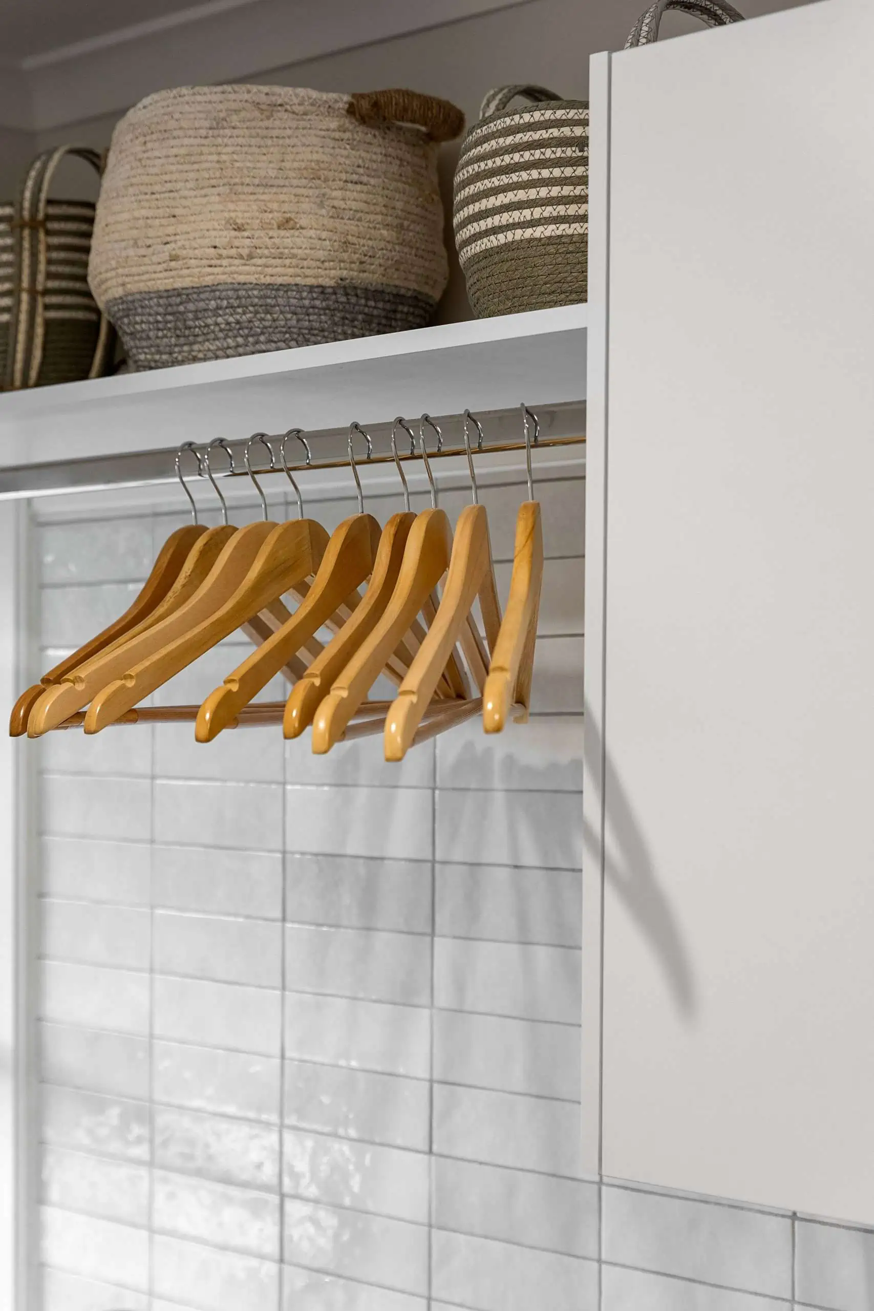 Close up of wooden hangers in a modern laundry space