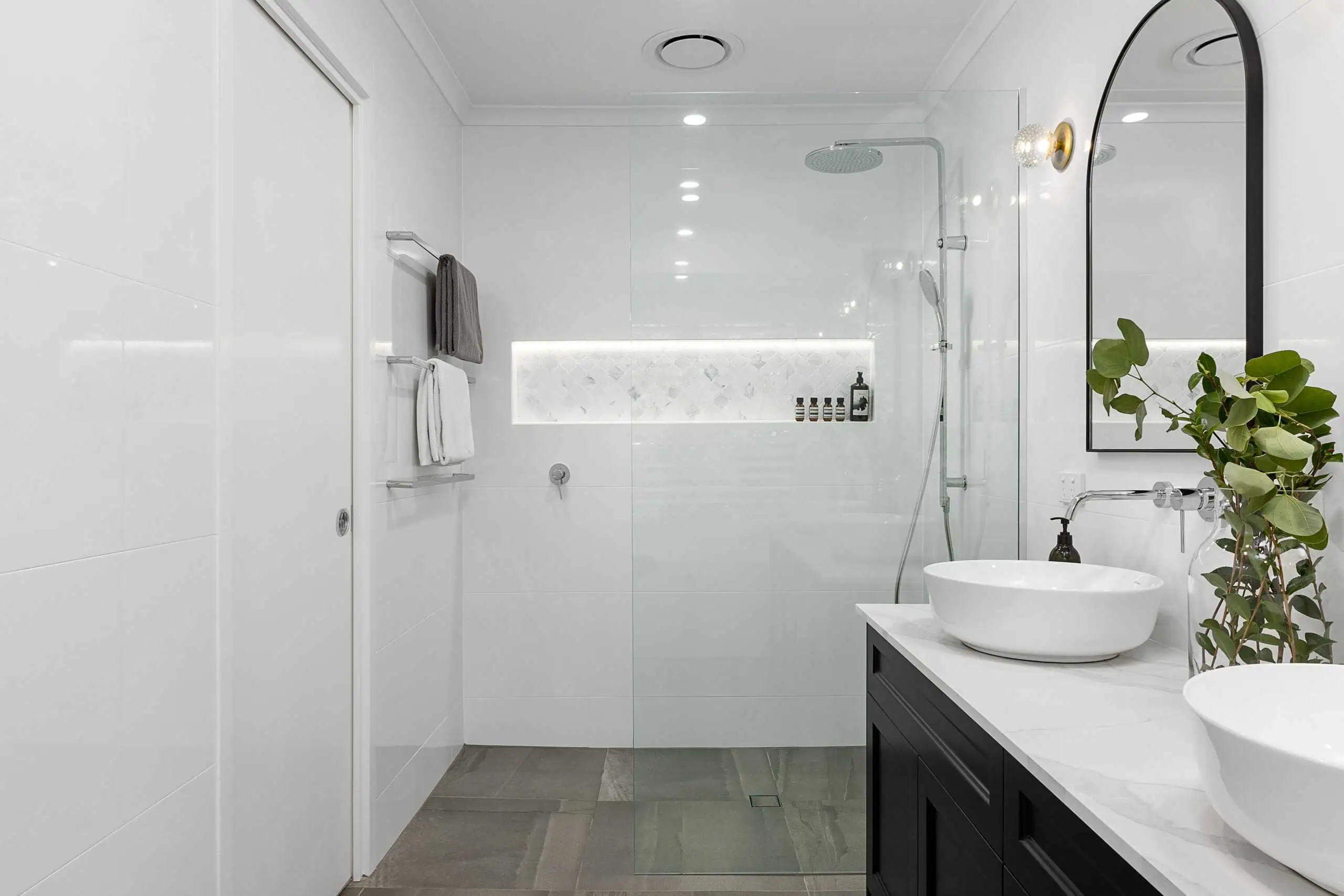 White bathroom with black and chrome features