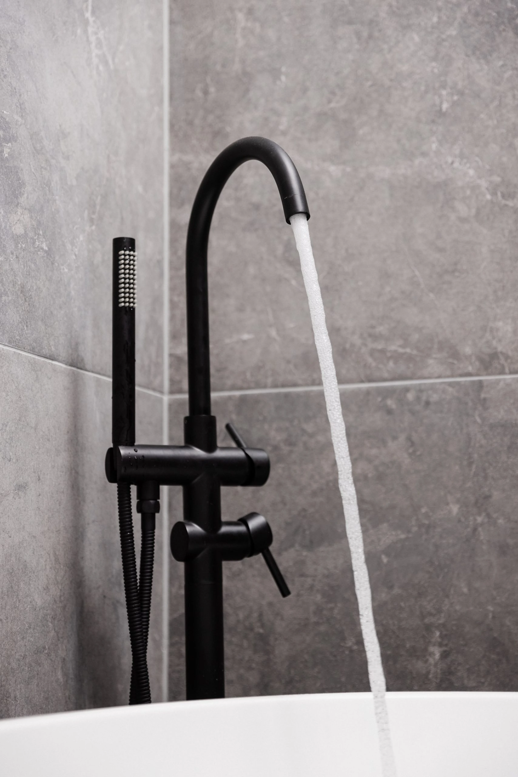 Matte black tap with white sink