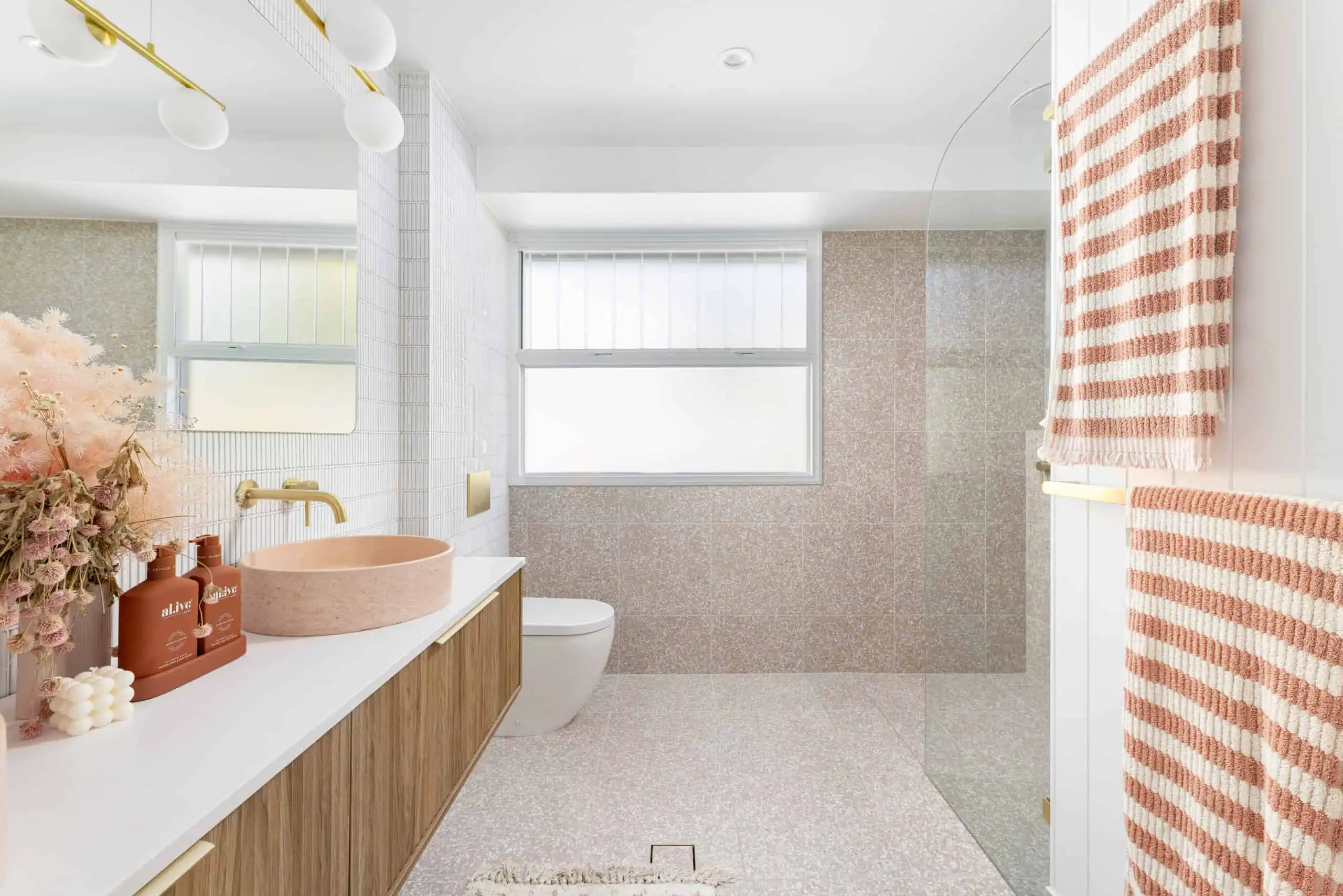 Blush pink, white and gold aesthetic bathroom renovation after shot.