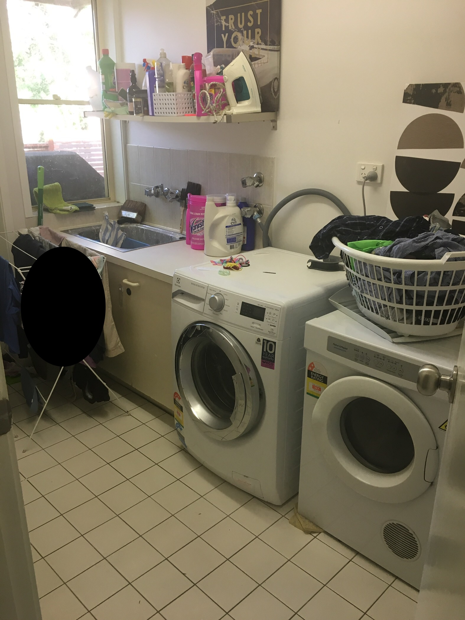 Before photograph of a laundry space