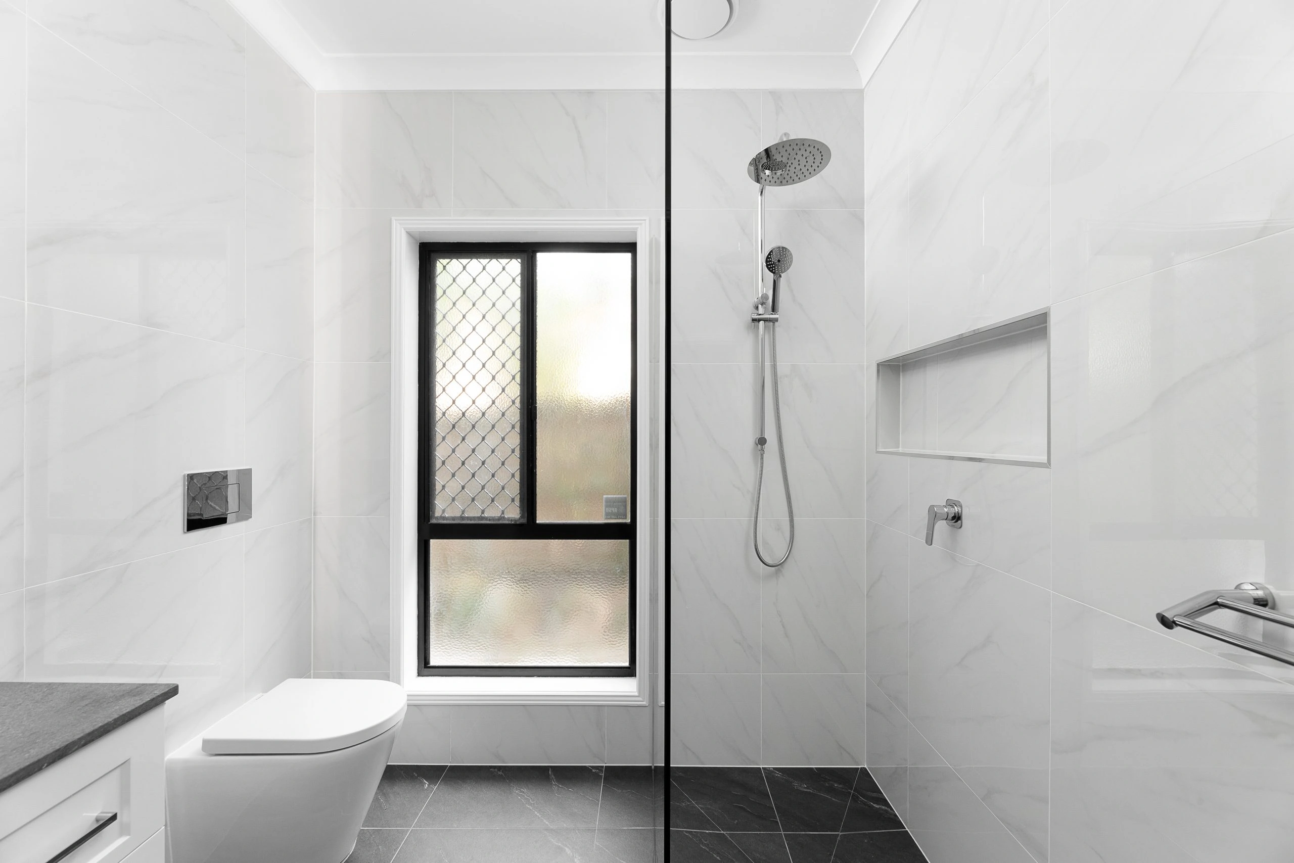 Black and white bathroom with chrome accessories