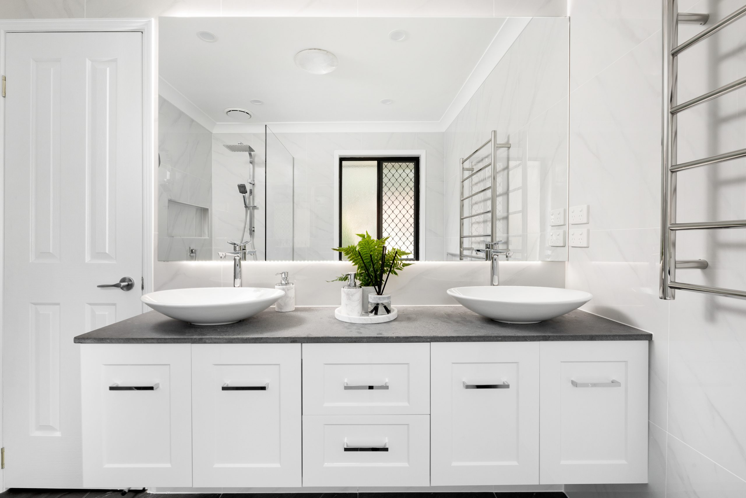 Bright, white bathroom with chrome details