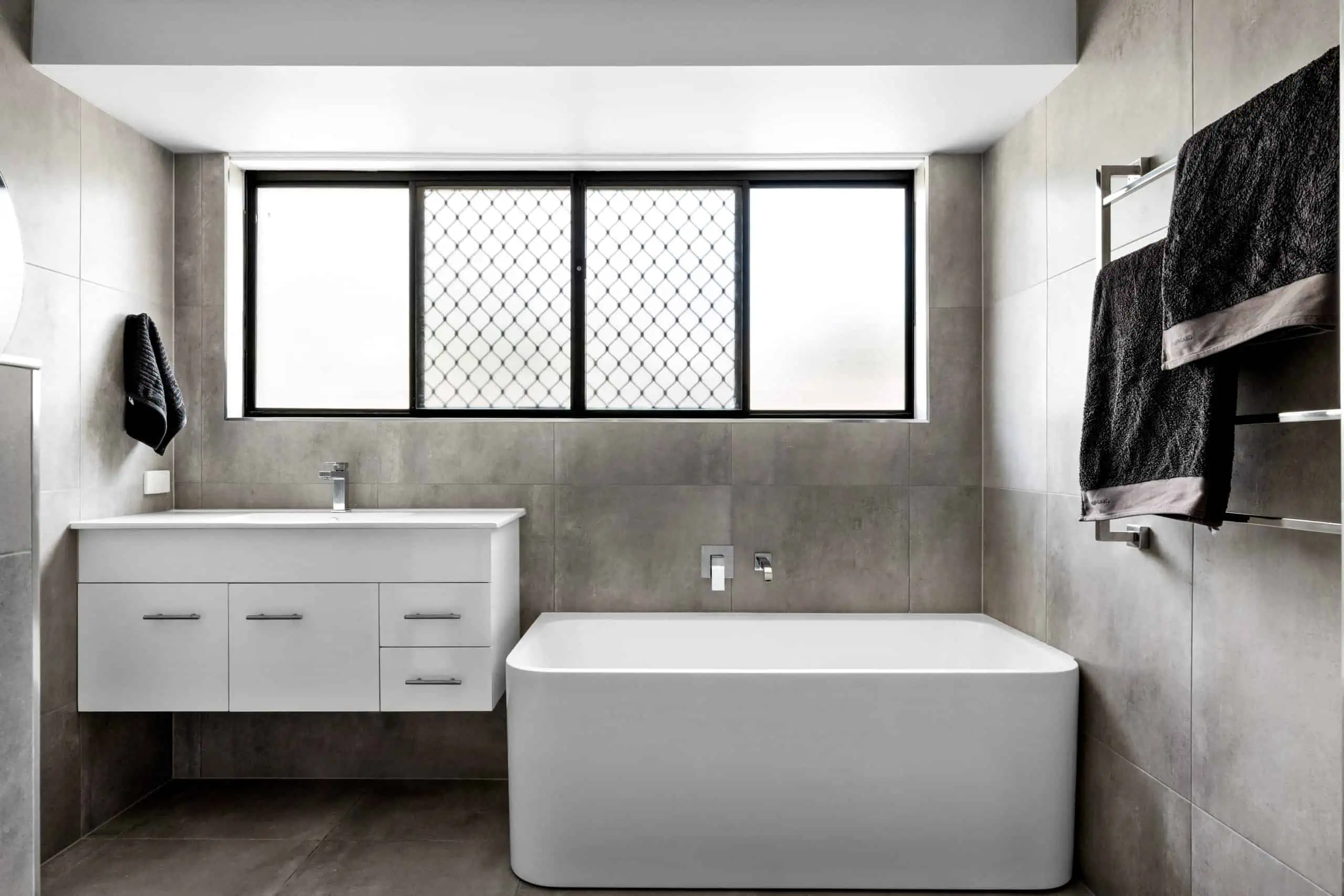 White bath and vanity in a modern bathroom