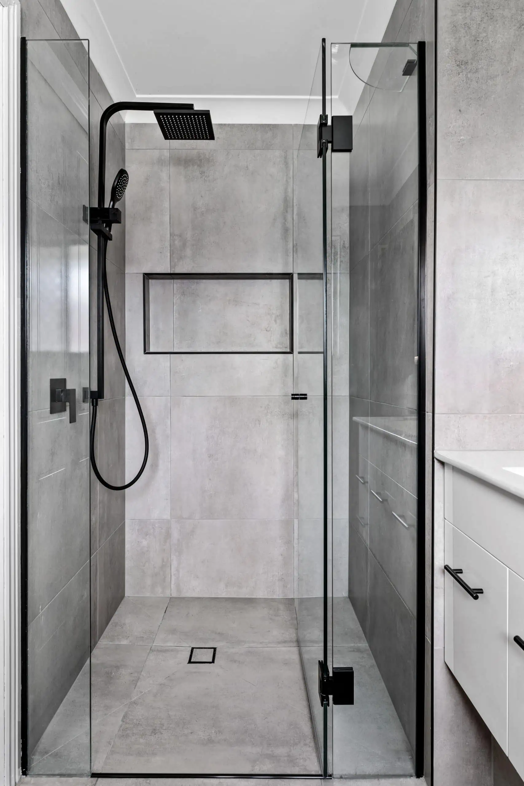 Modern grey bathroom with matte black details