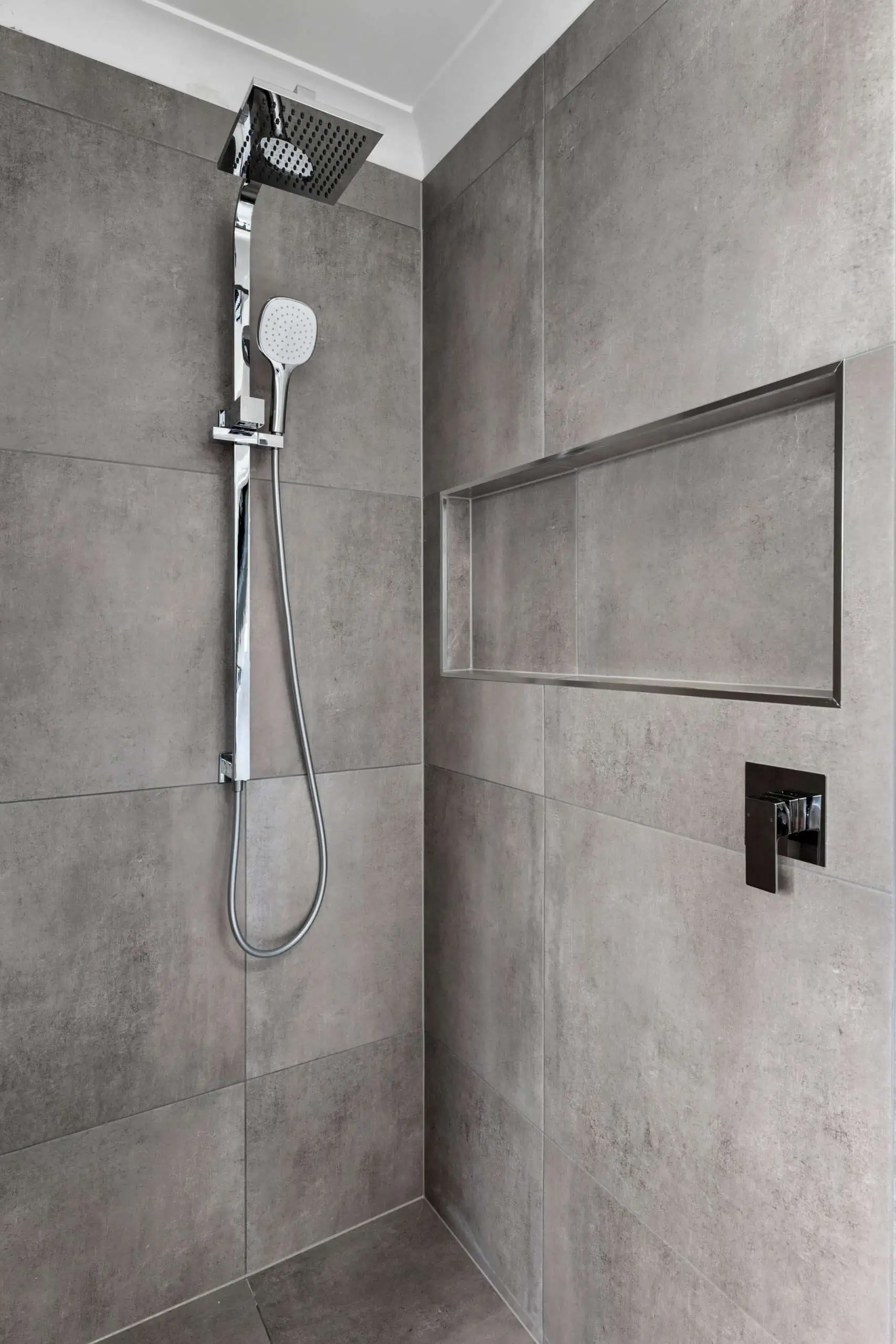 Chrome details in a shower area of a modern bathroom