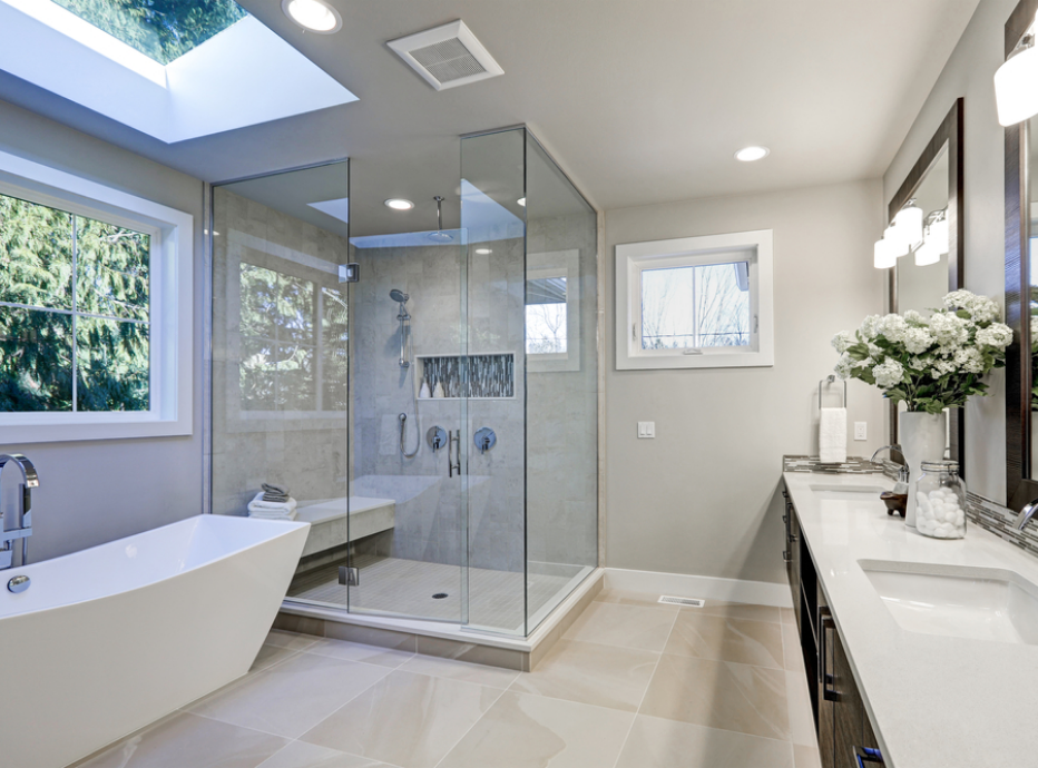 Light bathroom aesthetic featuring large shower cubicle, white angular bath and two sinks
