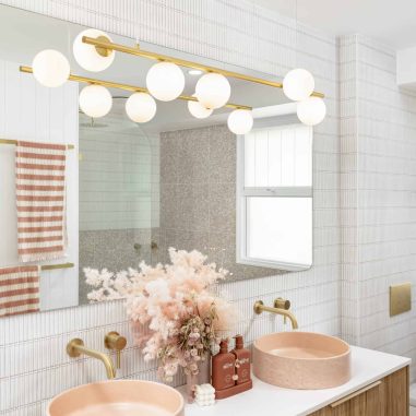 His and hers blush pink sinks on a modern vanity unit in a bathroom renovation